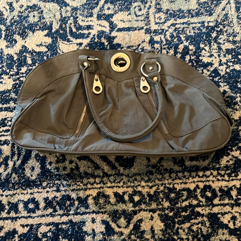 Nice washable Baggalini purse with multiple pockets.